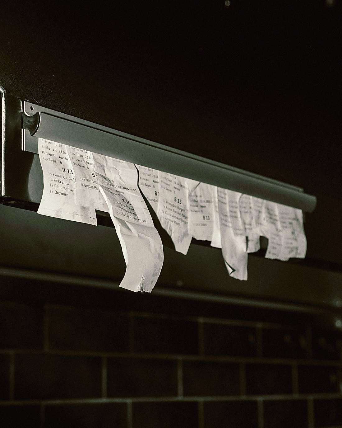 Order tickets hanging on a rail